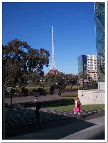 Albert and Kennedy running down steps at the back of Federation Square